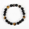 Bracciale pianeta in ossidiana argentata con perle occhio di tigre e ciondolo astronauta - Occhio di Tigre Giallo