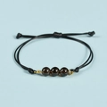 Minimalist black cord bracelet with three deep brown translucent beads and golden rings - Smoky Quartz