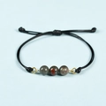 Adjustable black cord bracelet with three bloodstone beads and gold rings - African Blood Stone