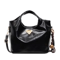 Glossy black bucket bag with golden logo and bell charm on a clean white background - Black