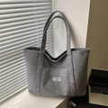 Deep grey corduroy tote bag with vertical stripes and fashion instinct label - Gray