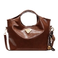 Brown vintage bucket bag with gold triangle plaque and woven bell charm detail - Brown