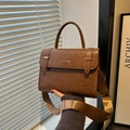 Brown vintage messenger bag with metal buckles and wide strap for women's fashion - Brown
