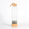 Bamboo glass water bottle with natural colorful crystal stones and woven handle strap - Colorful Fluorite