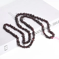 Deep red irregular garnet chips beads for DIY jewelry making on white background - Garnet