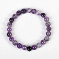 Natural purple amethyst beaded bracelet with single black obsidian stone and white veining - Amethyst