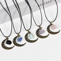 Vintage bronze crescent moon pendants with various natural crystal stones on black cords - Strawberry Quartz / Antique Bronze - Raw Stone Style