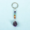 Chakra stone keychain featuring seven colored beads and raw natural amethyst pendant - Amethyst