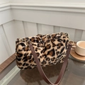 Leopard print plush shoulder bag with brown faux leather strap and golden hardware - Brown