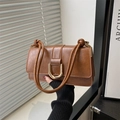 Brown vintage faux leather crossbody bag with gold U-shaped buckle and knotted strap - Brown