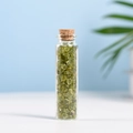 Natural peridot crystal stone chips in a slim glass bottle with cork for home decor - Olivine (3-5mm)
