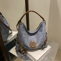 Retro grey washed canvas hobo bag with brown leather straps and metallic M logo - Blue