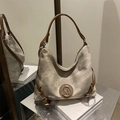 Light gray canvas tote bag with brown leather straps and metal M logo detail - Khaki