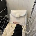 Chic cream-colored crossbody bag with soft faux fur trim and adjustable leather strap - White