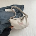 Borsa a sella beige chic con ricamo di farfalla rosa e trama martellata - Bianco