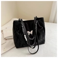 Black tote bag with metallic butterfly buckle and pearl chain charm detail - Black
