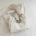 White textured leather tote bag with silver chain, pearl accents and butterfly charms - White
