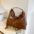 Maillard brown large hobo crossbody bag in shiny leather with eyelet strap details - Brown