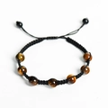 Handmade woven bracelet featuring seven natural tiger eye stones with adjustable cord - Tiger's Eye