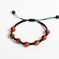 Handmade black woven rope bracelet featuring seven round red natural stone beads - Red Jasper