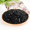 Polished natural black obsidian stones in a wooden bowl for crystal healing and decor - Obsidian / 5-7mm / 300g