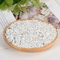 Natural white crystal quartz gravel stones in a wooden tray for home decor - Howlite / 3-5mm / 300g