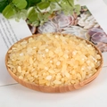 Natural tumbled citrine healing stones displayed on a minimalist round wooden tray - Yellow Jade / 5-7mm / 300g
