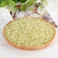 Natural light yellow-green raw crystal stones in a round wooden tray for decor - Citrine (Colored) / 3-5mm / 300g