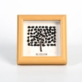 Kreativer Holzbilderrahmen mit Baumdesign aus schwarzen Edelsteinen und Kunsttext - Obsidian