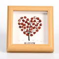 Wooden frame with heart-shaped red crystal stones and Blossom text on white base - Red Jasper