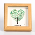 Handmade green crystal pebble heart tree in light wood frame with Blossom text - Green Aventurine