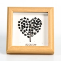 Wooden frame with heart-shaped black crystal stone tree art and Blossom text - Obsidian