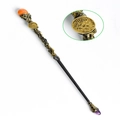 Bronze Virgo magic wand featuring an orange crystal sphere and textured metal handle - Virgo