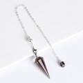 Smoky quartz crystal pendulum with silver chain for divination on white pedestal - Smoky Quartz