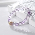 8mm natural purple amethyst bead bracelet with a golden crown charm on stone pedestal - Amethyst Crown Style