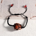 Adjustable hand-woven black cord bracelet with raw red agate stone in mesh pouch - Red Agate