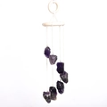 Natural purple amethyst wind chime featuring raw crystal stones and white circular holder - Amethyst