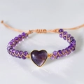 Handmade woven heart-shaped amethyst bracelet with purple beads and adjustable beige cord - Amethyst