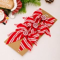 Three-piece red and white striped Christmas bow hair clips with candy center on kraft card - Candy Red White Bow Thin Striped