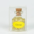Polished Citrine natural crystal stone chips in a clear glass bottle with cork stopper - Citrine