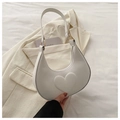 Detail of white leather heart crescent bag with embossed heart and gold metal hardware - Off White