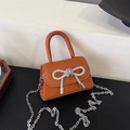 Mini caramel brown handbag with rhinestone bow decoration and silver chain strap - Brown
