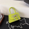 Mini neon green crossbody bag with silver rhinestone bow and metal chain strap - Green