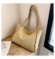 Large beige woven straw tote bag with light brown faux leather handles for summer travel - Khaki