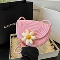 Handwoven pink straw saddle bag with a large white daisy flower and smiley face detail - Pink