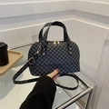 Navy blue shell bag with geometric patterns, dual handles and a golden crossbody strap - Black