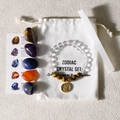 Zodiac crystal set with tiger eye bracelet, polished stones and cotton pouch on beige base - Taurus