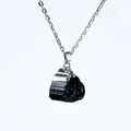 Raw black tourmaline pendant necklace with irregular stone texture and silver chain - Black Tourmaline Silver Plated