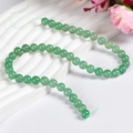 Perles rondes en aventurine verte naturelle pour bijoux DIY sur présentoir blanc ondulé - Taille Huit