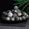 Polished labradorite tumbled stones with blue flash highlights in a black bowl decor - Labradorite 2-3cm 100g